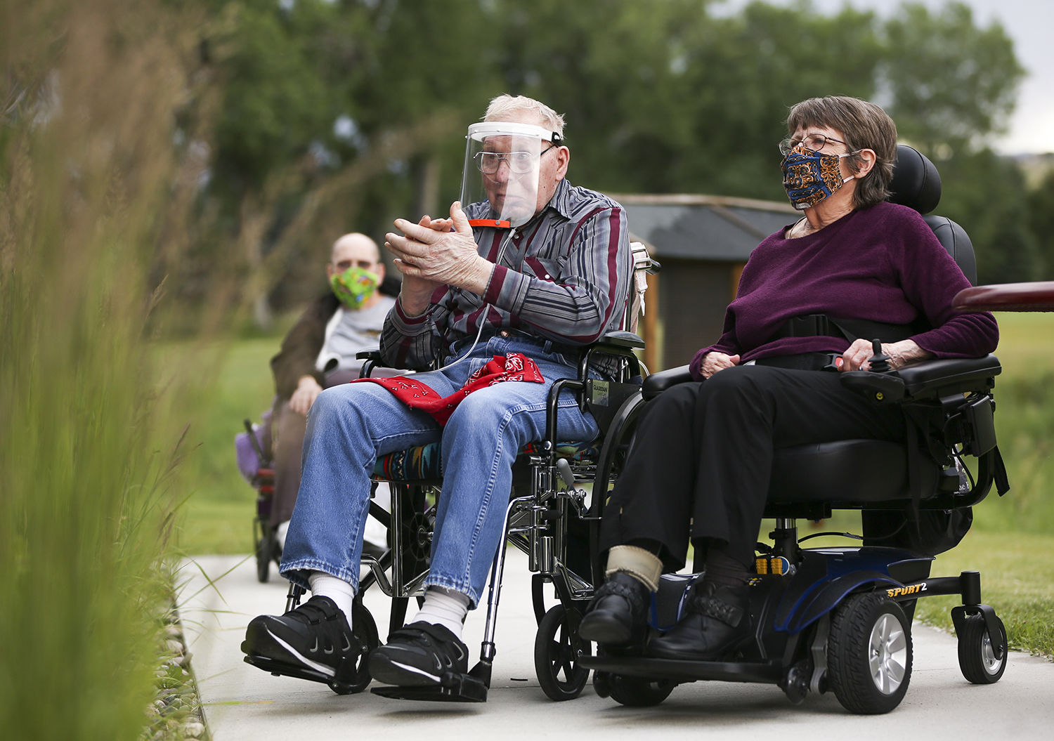 Gordon Christensen claps next to his wife Linda after a song ended